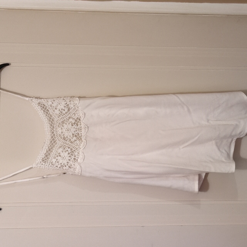Maurice's white tank